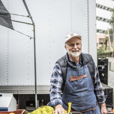 Local supplier with produce at market