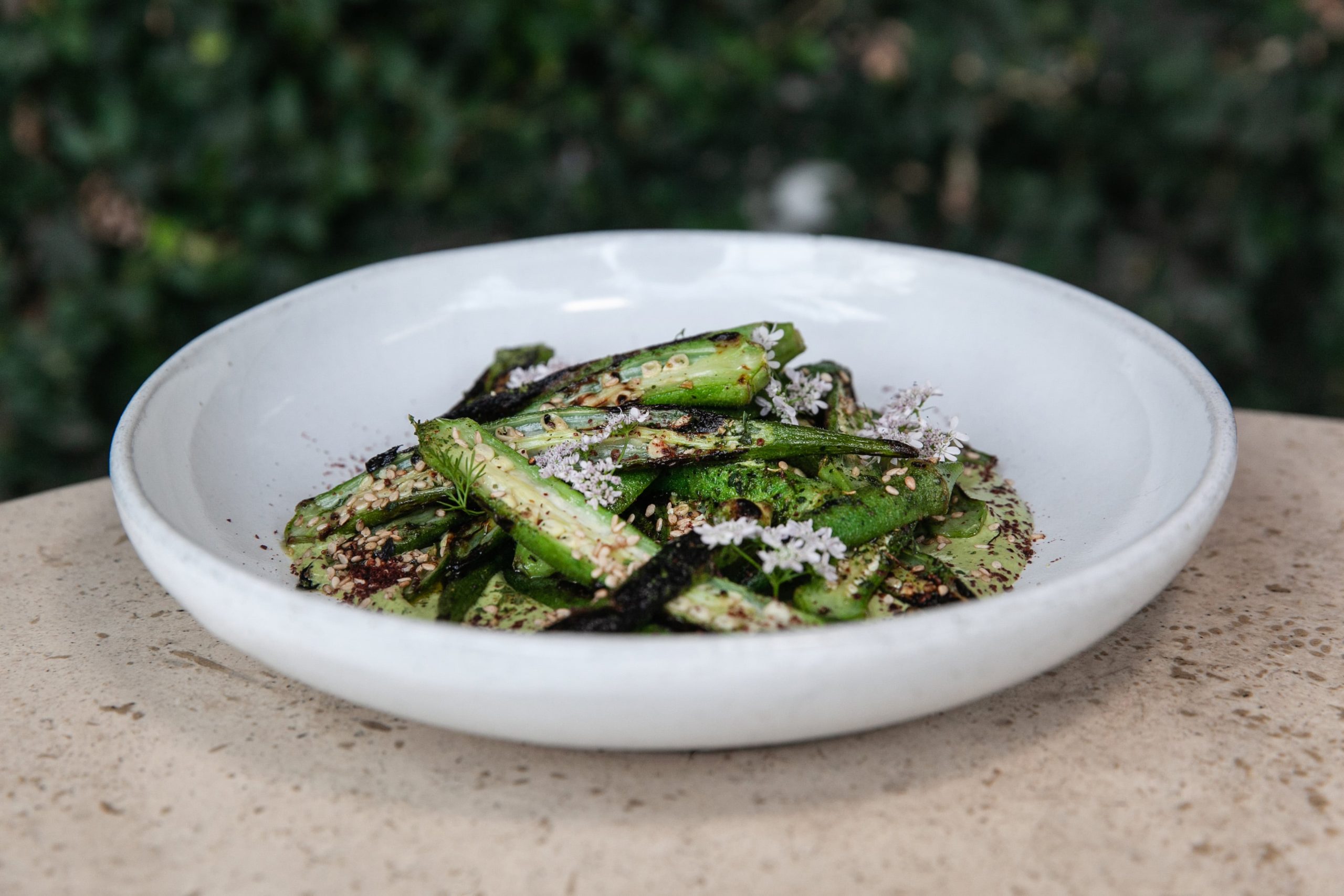 Bowl of okra with green chilli oil