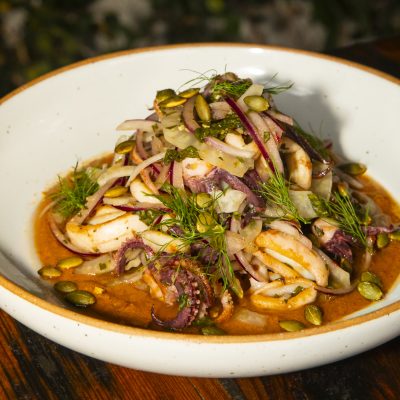 pepita romesco, Italian salsa verde, shaved fennel, red onion